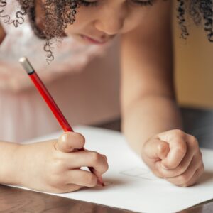 girl drawing on paper