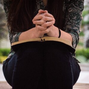 woman praying with Bible