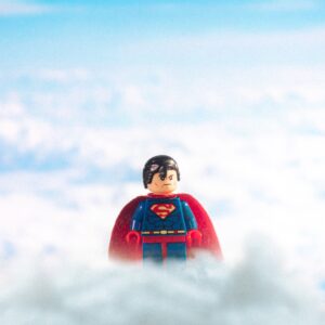 superman toy in clouds