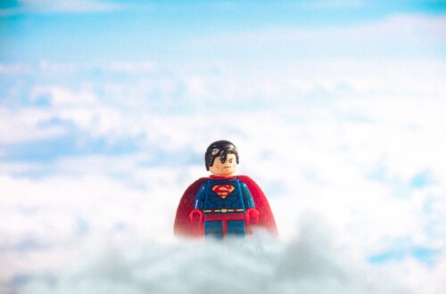 superman toy in clouds